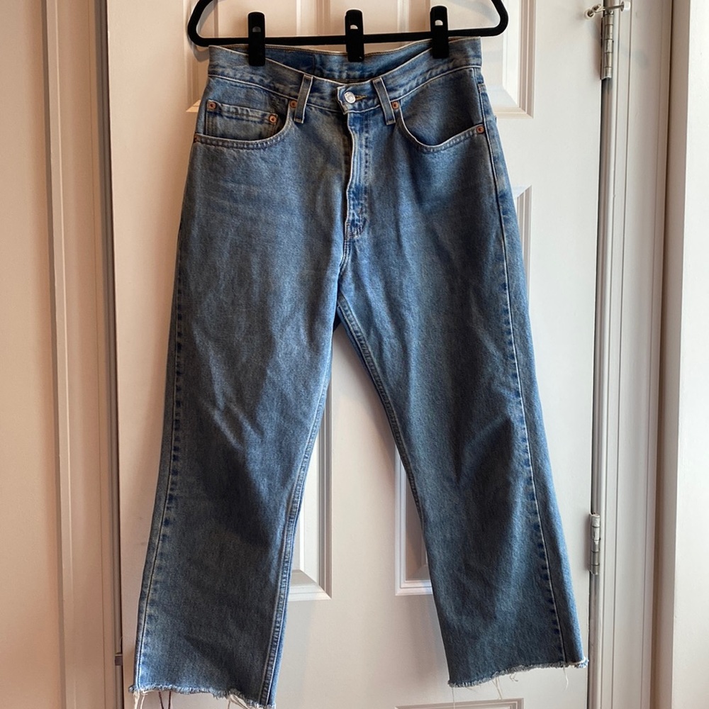 Vintage Levi’s 505 Regular Fit Straight Leg jeans with cut hem.